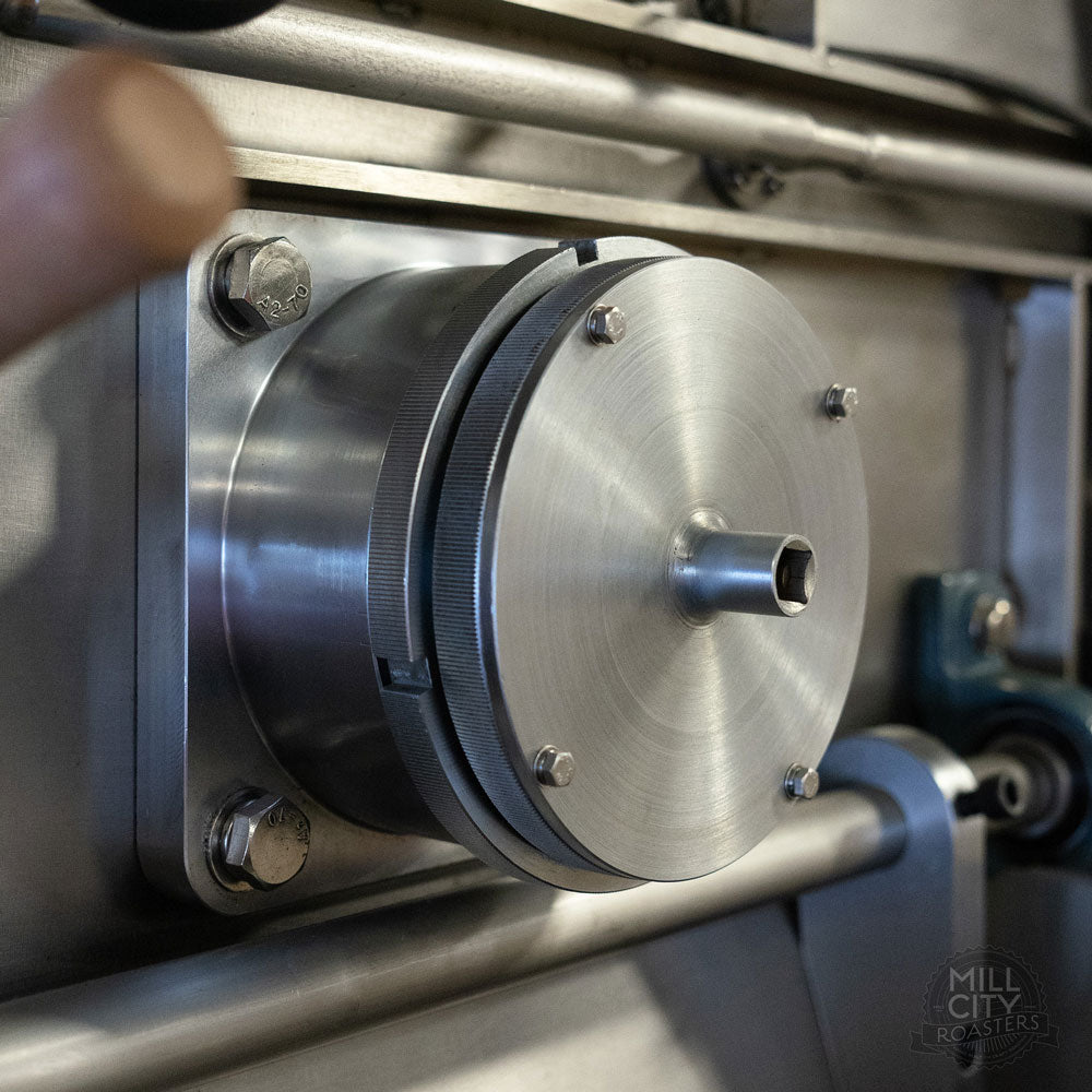 Custom designed and fabricated precision drum adjustment mechanism.