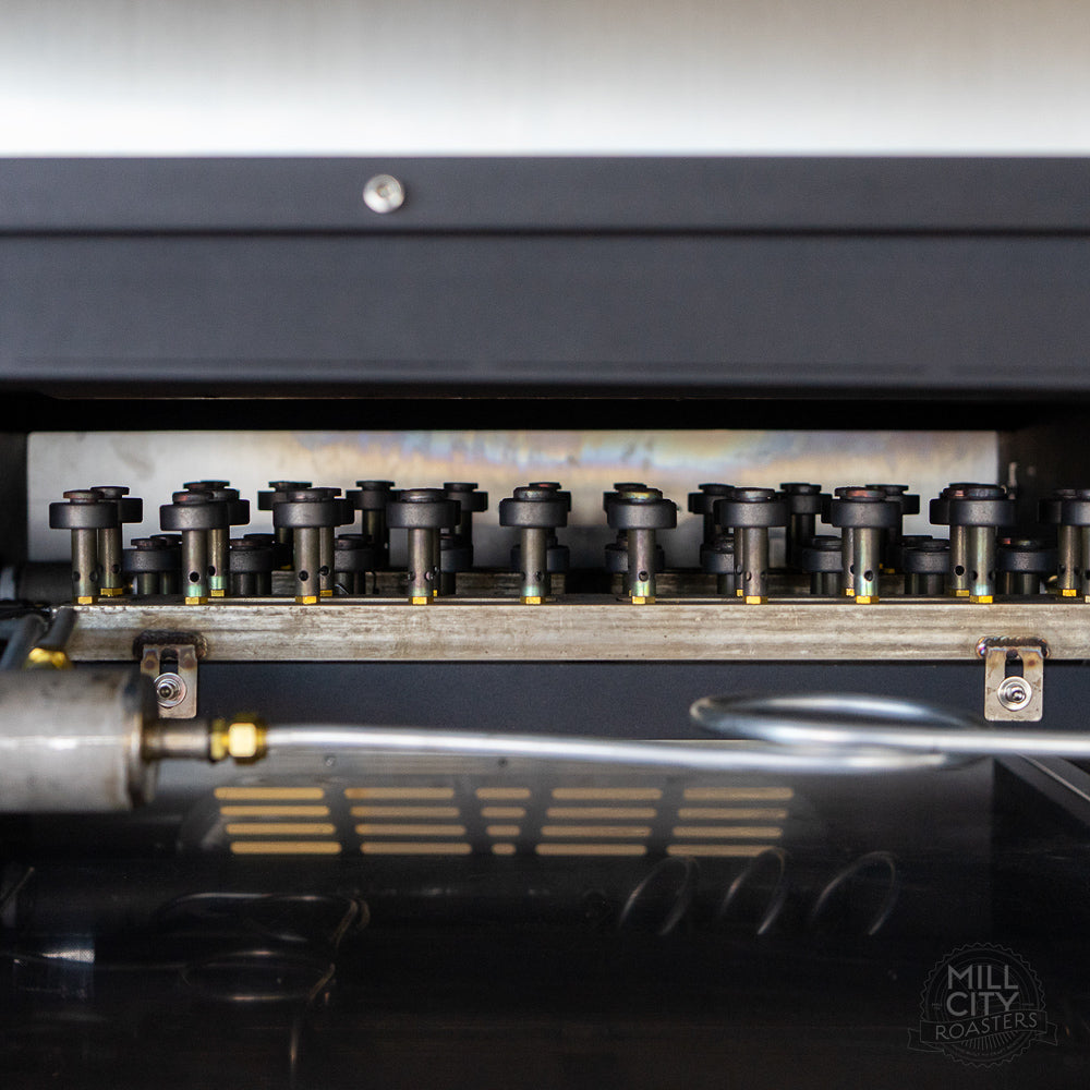 Infinitely adjustable open flame atmospheric burners offer more precise application of heat throughout the roast.