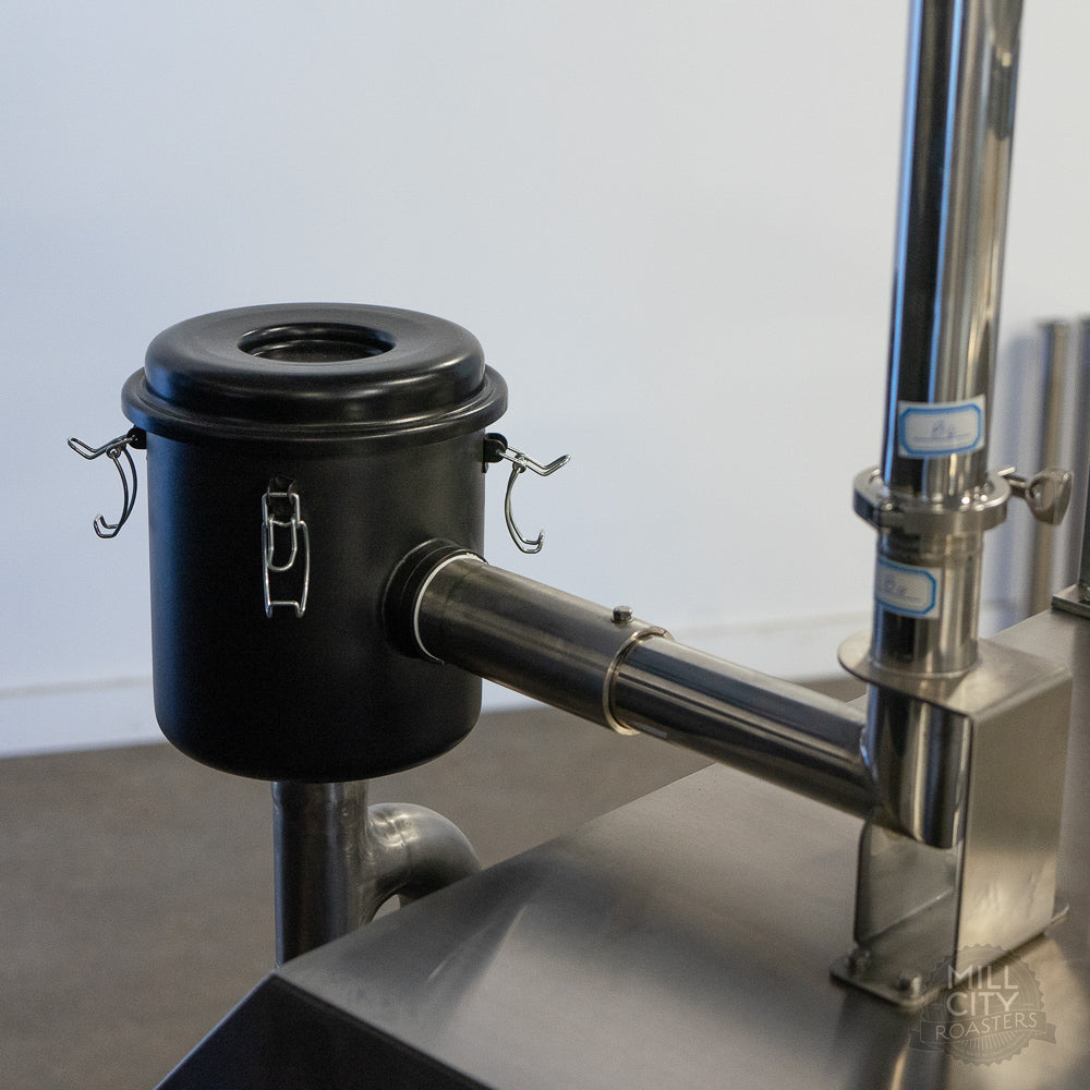 High efficiency loader filter reduces green coffee dust inside and outside the roaster.