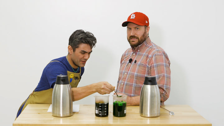 Two brewers are conducting experiments to show how coffee roast level affects extraction