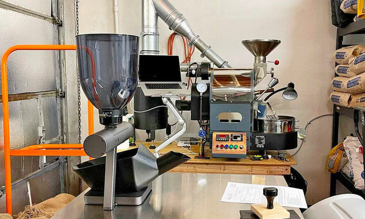 A roaster and bag filling machine setup in a