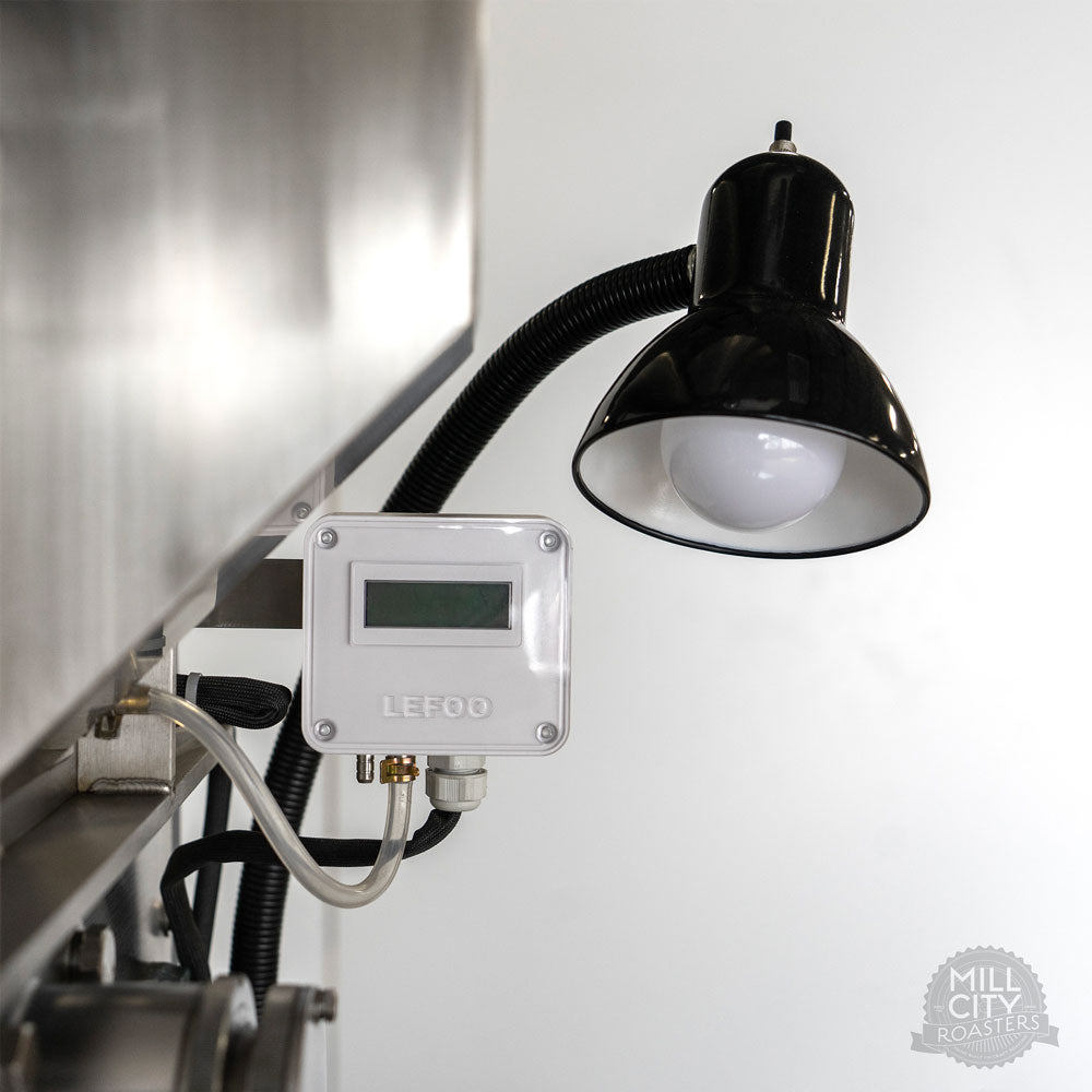 Custom drum pressure gauge verifies control panel airflow settings for more precisely repeatable roasting.