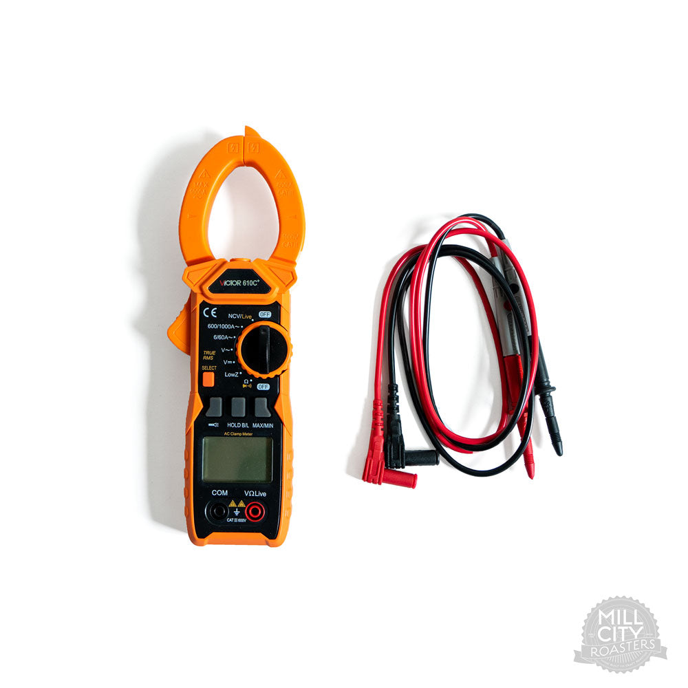 Digital clamp multimeter next to the included electrical probes