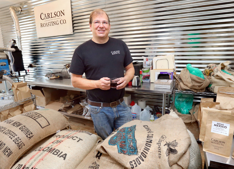 Carlson Roasting Owner Bob Carlson with Bags of Green Coffee