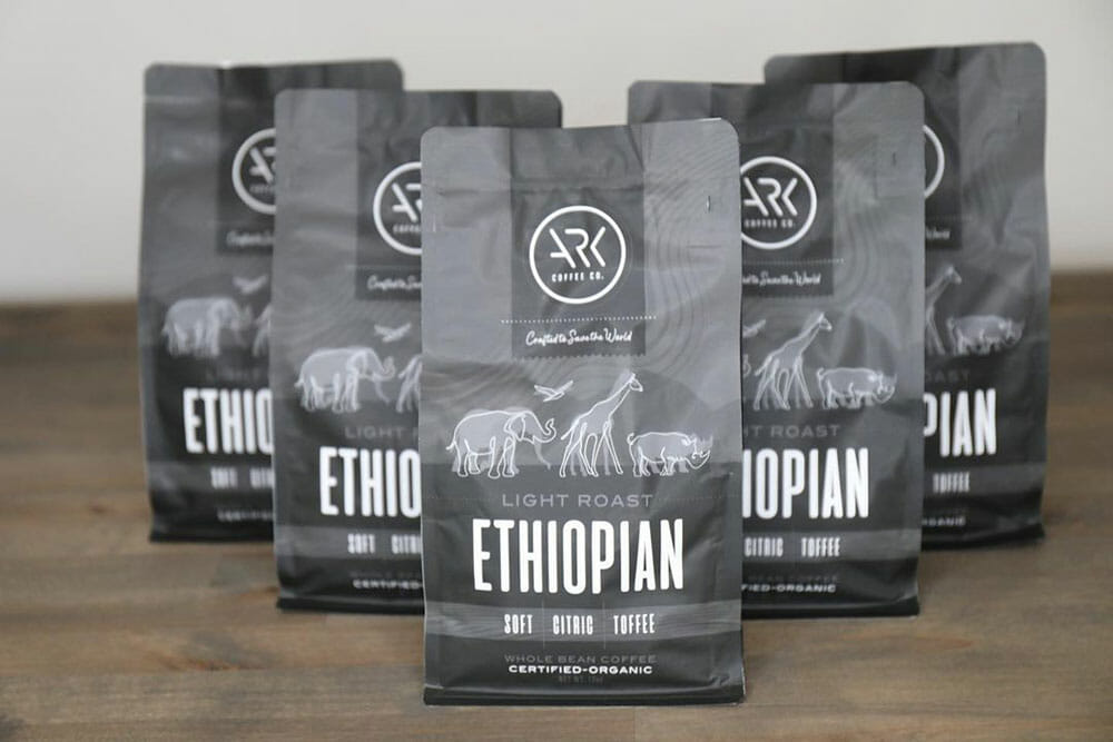 Several gray bags of forming a V shape. There is artwork of animals on the bags with the text "Ethiopian."